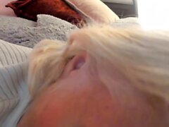 Blonde mature with big boobs masturbates in bed