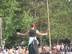 Ravishing redhead performs striptease in public